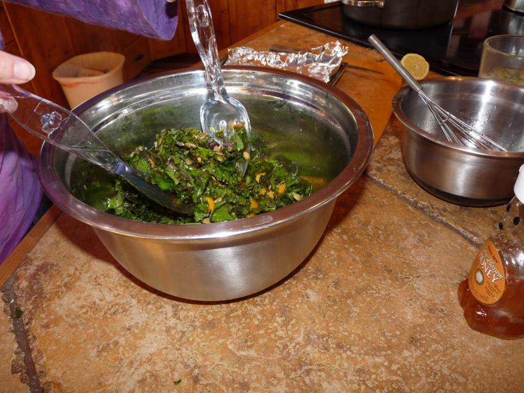Add pumpkin seeds or (pine nuts), and dressing to kale, mango, and avocado, toss salad, and serve!