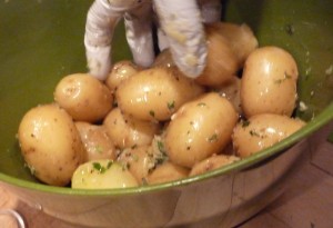 Toss potatoes with herb oil